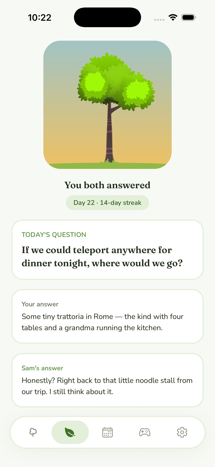 Daily question reveal screen: both partners' answers shown side by side under today's question